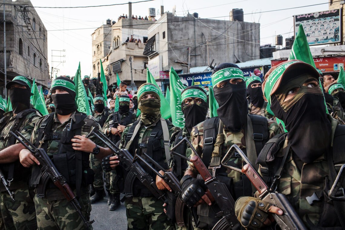 GAZA CITY, GAZA - JULY 20:  Palestinian Hamas militants are seen during a military show in the Bani Suheila district on July 20, 2017 in Gaza City, Gaza. For the past ten years Gaza residents have lived with constant power shortages, in recent years these cuts have worsened, with supply of regular power limited to four hours a day. On June 11, 2017 Israel announced a new round of cuts at the request of the Palestinian authorities and the decision was seen as an attempt by President Mahmoud Abbas to pressure Gaza's Hamas leadership. Prior to the new cuts Gaza received 150 megawatts per day, far below it's requirements of 450 megawatts. In April, Gaza's sole power station which supplied 60 megawatts shut down, after running out of fuel, the three lines from Egypt, which provided 27 megawatts are rarely operational, leaving Gaza reliant on the 125 megawatts supplied by Israel's power plant. The new cuts now restrict electricity to three hours a day severely effecting hospital patients with chronic conditions and babies on life support. During blackout hours residents use private generators, solar panels and battery operated light sources to live. June 2017 also marked ten years since Israel began a land, sea and air blockade over Gaza. Under the blockade, movement of people and goods is restricted and exports and imports of raw materials have been banned. The restrictions have virtually cut off access for Gaza's two million residents to the outside world and unemployment rates have skyrocketed forcing many people into poverty and leaving approximately 80% of the population dependent on humanitarian aid.  (Photo by Chris McGrath/Getty Images)