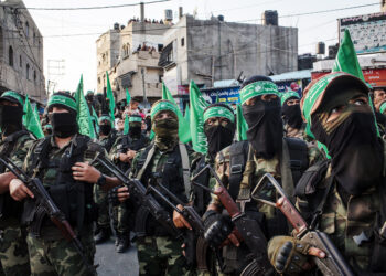 GAZA CITY, GAZA - JULY 20:  Palestinian Hamas militants are seen during a military show in the Bani Suheila district on July 20, 2017 in Gaza City, Gaza. For the past ten years Gaza residents have lived with constant power shortages, in recent years these cuts have worsened, with supply of regular power limited to four hours a day. On June 11, 2017 Israel announced a new round of cuts at the request of the Palestinian authorities and the decision was seen as an attempt by President Mahmoud Abbas to pressure Gaza's Hamas leadership. Prior to the new cuts Gaza received 150 megawatts per day, far below it's requirements of 450 megawatts. In April, Gaza's sole power station which supplied 60 megawatts shut down, after running out of fuel, the three lines from Egypt, which provided 27 megawatts are rarely operational, leaving Gaza reliant on the 125 megawatts supplied by Israel's power plant. The new cuts now restrict electricity to three hours a day severely effecting hospital patients with chronic conditions and babies on life support. During blackout hours residents use private generators, solar panels and battery operated light sources to live. June 2017 also marked ten years since Israel began a land, sea and air blockade over Gaza. Under the blockade, movement of people and goods is restricted and exports and imports of raw materials have been banned. The restrictions have virtually cut off access for Gaza's two million residents to the outside world and unemployment rates have skyrocketed forcing many people into poverty and leaving approximately 80% of the population dependent on humanitarian aid.  (Photo by Chris McGrath/Getty Images)