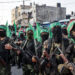 GAZA CITY, GAZA - JULY 20:  Palestinian Hamas militants are seen during a military show in the Bani Suheila district on July 20, 2017 in Gaza City, Gaza. For the past ten years Gaza residents have lived with constant power shortages, in recent years these cuts have worsened, with supply of regular power limited to four hours a day. On June 11, 2017 Israel announced a new round of cuts at the request of the Palestinian authorities and the decision was seen as an attempt by President Mahmoud Abbas to pressure Gaza's Hamas leadership. Prior to the new cuts Gaza received 150 megawatts per day, far below it's requirements of 450 megawatts. In April, Gaza's sole power station which supplied 60 megawatts shut down, after running out of fuel, the three lines from Egypt, which provided 27 megawatts are rarely operational, leaving Gaza reliant on the 125 megawatts supplied by Israel's power plant. The new cuts now restrict electricity to three hours a day severely effecting hospital patients with chronic conditions and babies on life support. During blackout hours residents use private generators, solar panels and battery operated light sources to live. June 2017 also marked ten years since Israel began a land, sea and air blockade over Gaza. Under the blockade, movement of people and goods is restricted and exports and imports of raw materials have been banned. The restrictions have virtually cut off access for Gaza's two million residents to the outside world and unemployment rates have skyrocketed forcing many people into poverty and leaving approximately 80% of the population dependent on humanitarian aid.  (Photo by Chris McGrath/Getty Images)