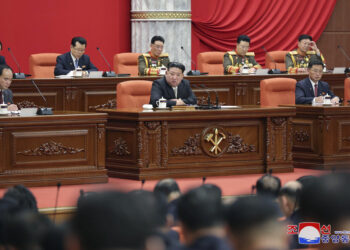 In this photo provided by the North Korean government, North Korean leader Kim Jong Un delivers a speech during a year-end plenary meeting of the ruling Workers’ Party in Pyongyang, North Korea, Thursday, Dec. 28, 2023. Independent journalists were not given access to cover the event depicted in this image distributed by the North Korean government. The content of this image is as provided and cannot be independently verified. Korean language watermark on image as provided by source reads: "KCNA" which is the abbreviation for Korean Central News Agency. (Korean Central News Agency/Korea News Service via AP)