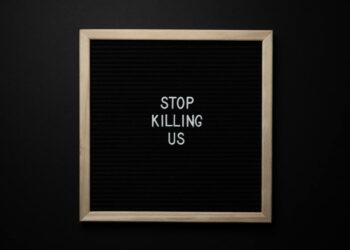 phrase stop killing us on signboard